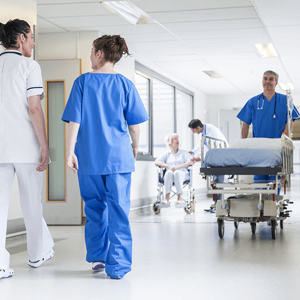 Healthcare professionals in hospital corridor